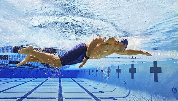 Swimming with a waterproof fitness tracker.